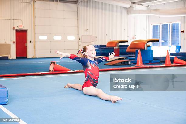Young Gymnast Doing Floor Routine Stock Photo - Download Image Now - Gymnastics, Balance Beam, Child