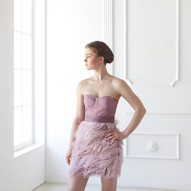 istock Young woman in white interior 175435495