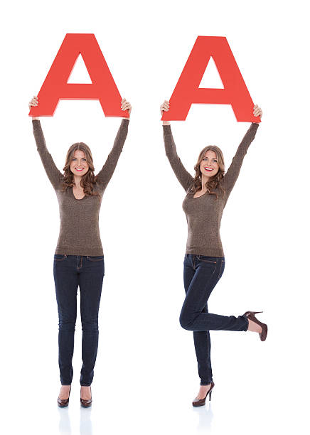 istock Woman holding letter A. 175435613