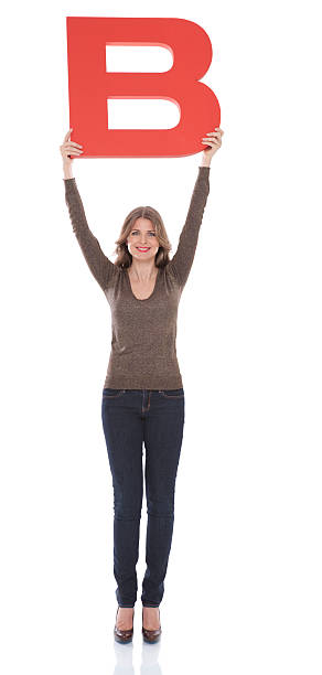 istock Woman holding letter B. 175435643