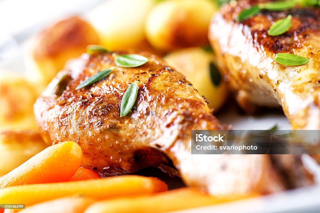 Roast chicken with mixed vegetables Animal Body Part Stock Photo