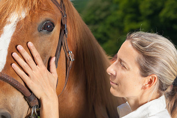 istock close up woman horse 175436757
