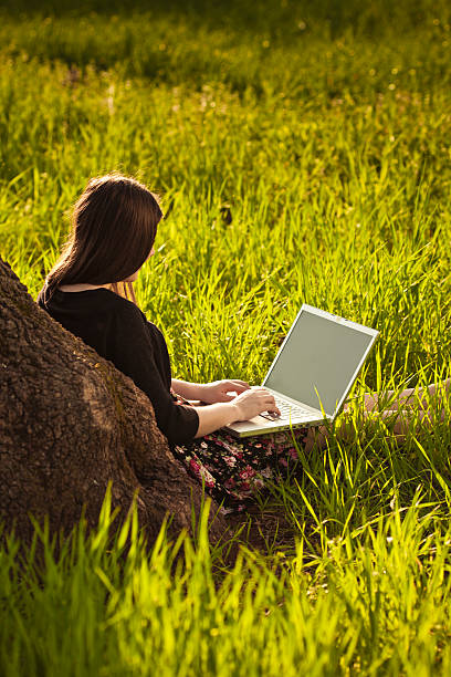 istock Young woman with laptop 175436944