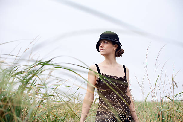 Woman in windy grass