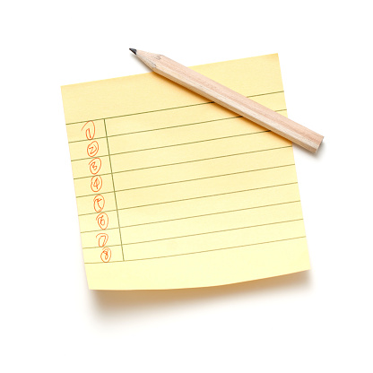 Sticky note of lined paper isolated on white background.