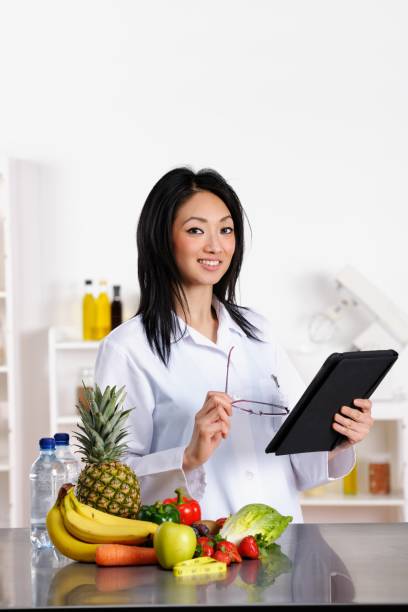 istock Oriental Healthcare Professional Using Digital Tablet 175437425
