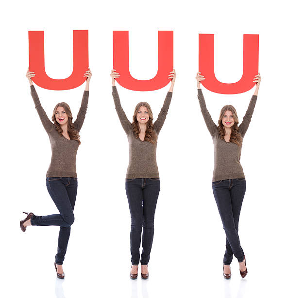 istock Woman holding letter U. 175437440