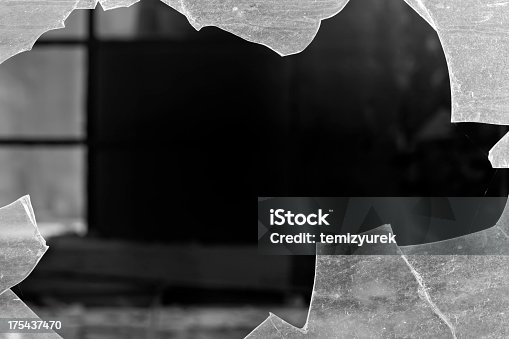 istock Close up photo of a hole in a broken window 175437470