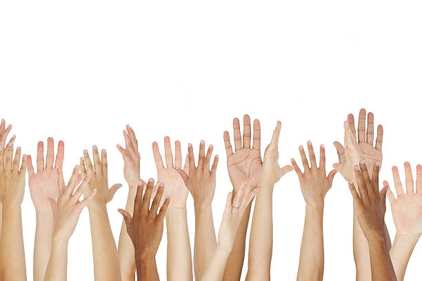 istock Close Up Of A Group Raising Their Hands 175437646