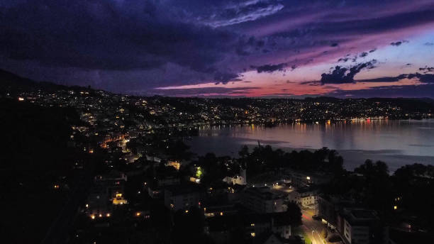 istock Small city near the lake at night 1754376722