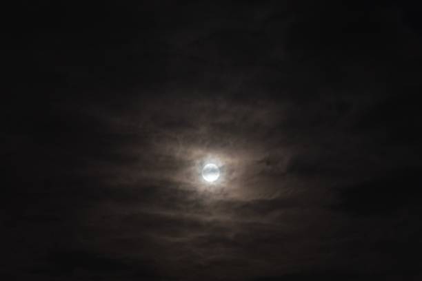 istock Beautiful cloudy and gloomy sky with shining moon 1754381372