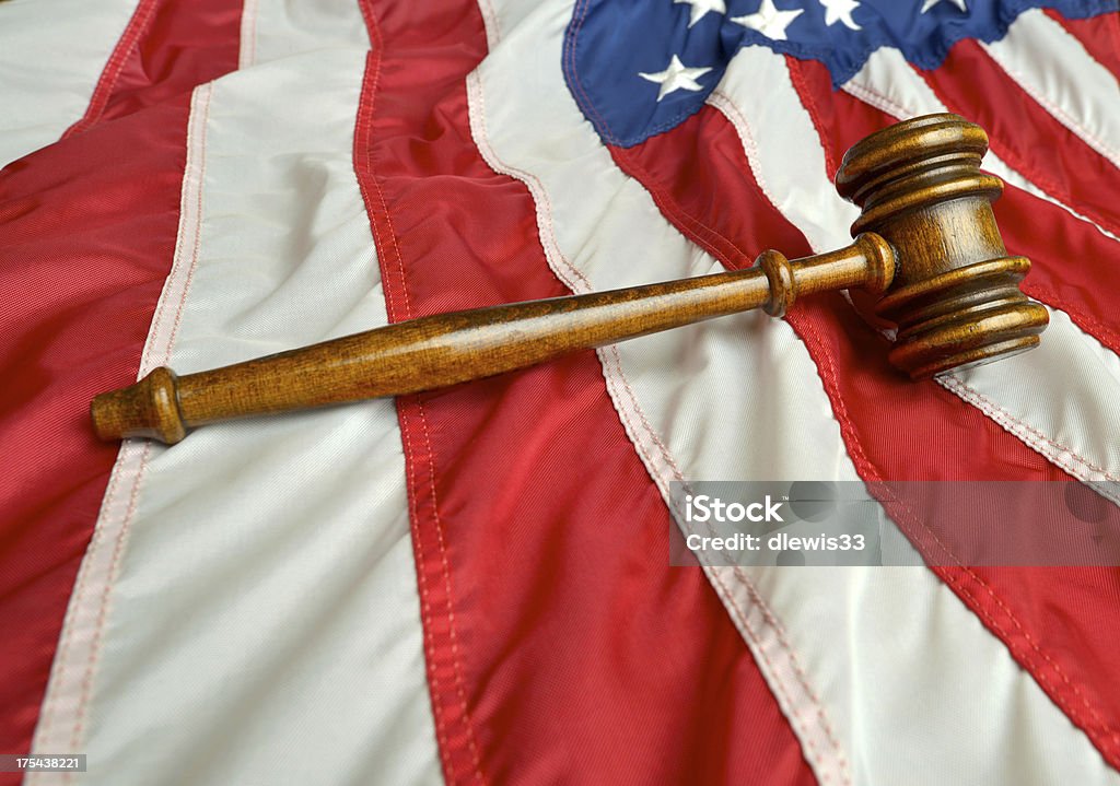 American Flag with Gavel Still life of American flag with a wooden gavel representing the rule of law. American Flag Stock Photo