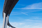 curved viaduct against blue sky