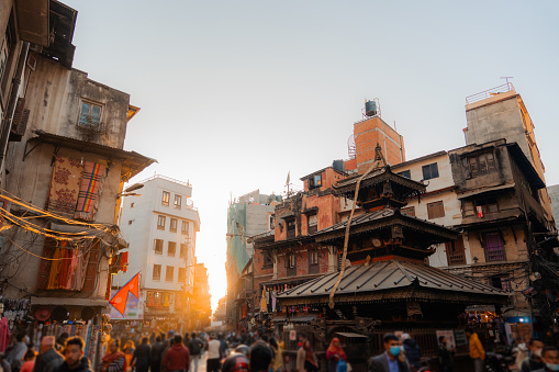 Chaotic crowded  Kathmandu city square in warm sunset light