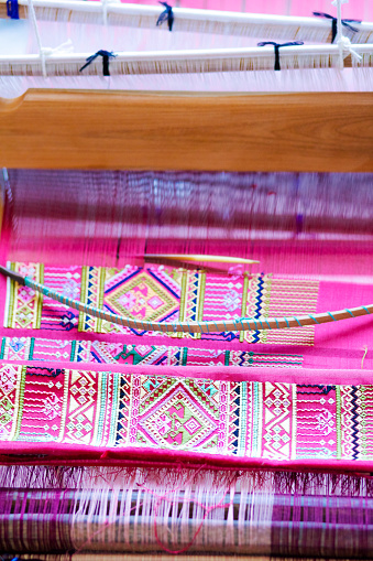 Folded traditional thai loomed fabric in loom  in village in Phitsanulok province, area Parangmee