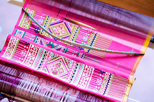 Folded traditional thai loomed fabric in village in Phitsanulok province, area Parangmee