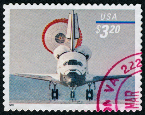 Cancelled Stamp From The United States Featuring A Space Shutter Returning To Earth