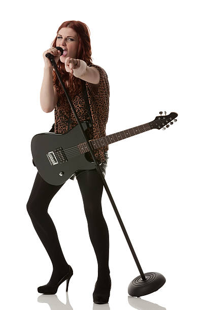 istock Woman singing into a microphone 175440078