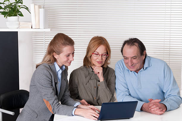 istock Mature Couple and Financial Advisor 175440139