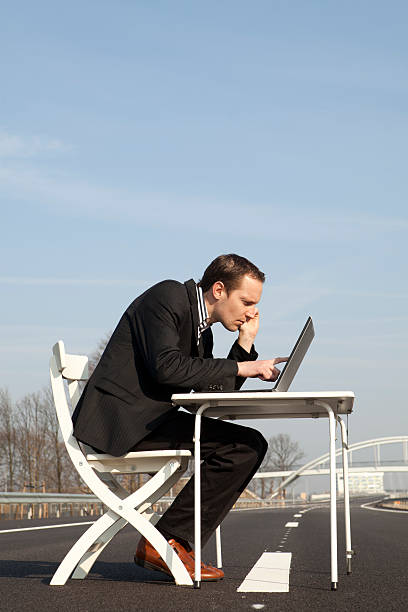istock Businessman Working On Laptop, Main Road 175440232