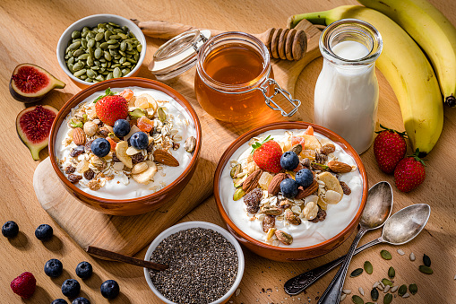 Two granola bowls on breakfast table