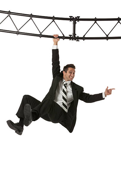 istock Businessman hanging from a metal structure 175440569