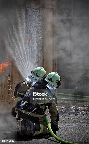 Firefighters Stock Photo - Download Image Now - Accidents and Disasters, Activity, Assistance