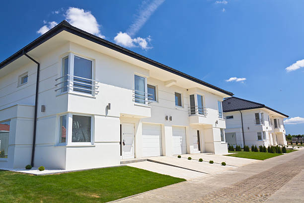 istock White apartment houses against blue sky 175441124