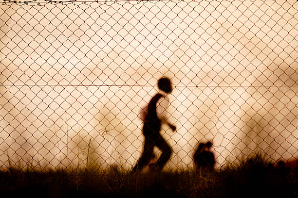 istock Children behind fences 175441270