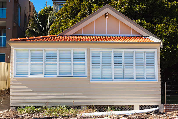istock Beach hut with white surfboard front of the house 175441272