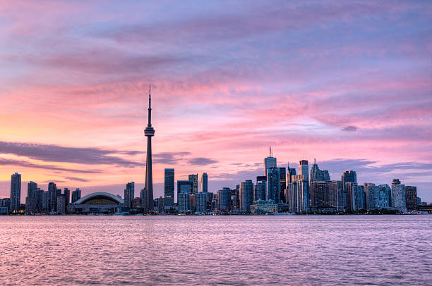 The city lights coming up against the fading sky over the Canadian city of Toronto.