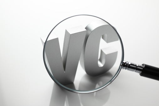 Financial concept. Looking through magnifying glass to block letter word - VC (Venture Capital).Similar images -