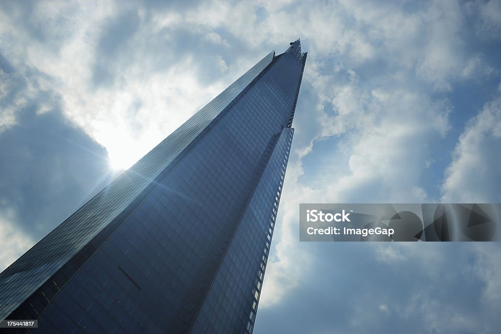 The Shard Tip of The Shard at London Bridge and clouds with lens flare Architecture Stock Photo