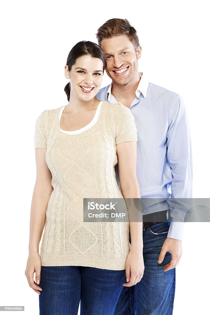 Beautiful portrait of smiling young couple Beautiful portrait of smiling young couple standing together on white background Adult Stock Photo