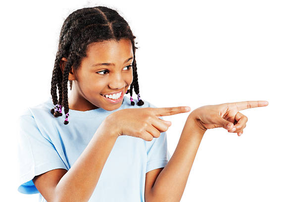 istock African American girl pointing aside. 175442155