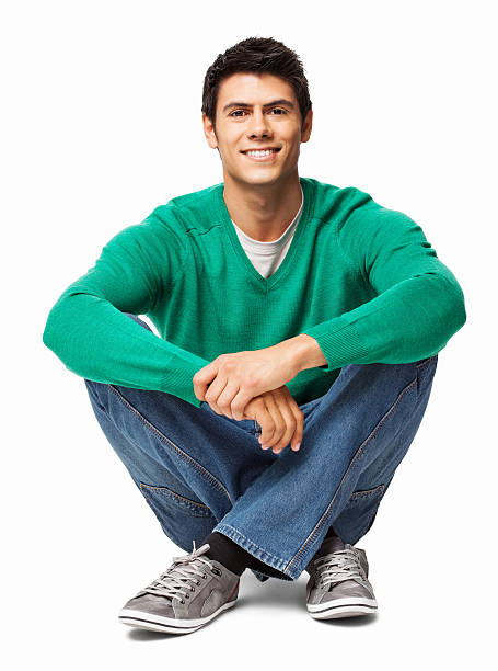 Relaxed Young Man Sitting On Floor - Isolated