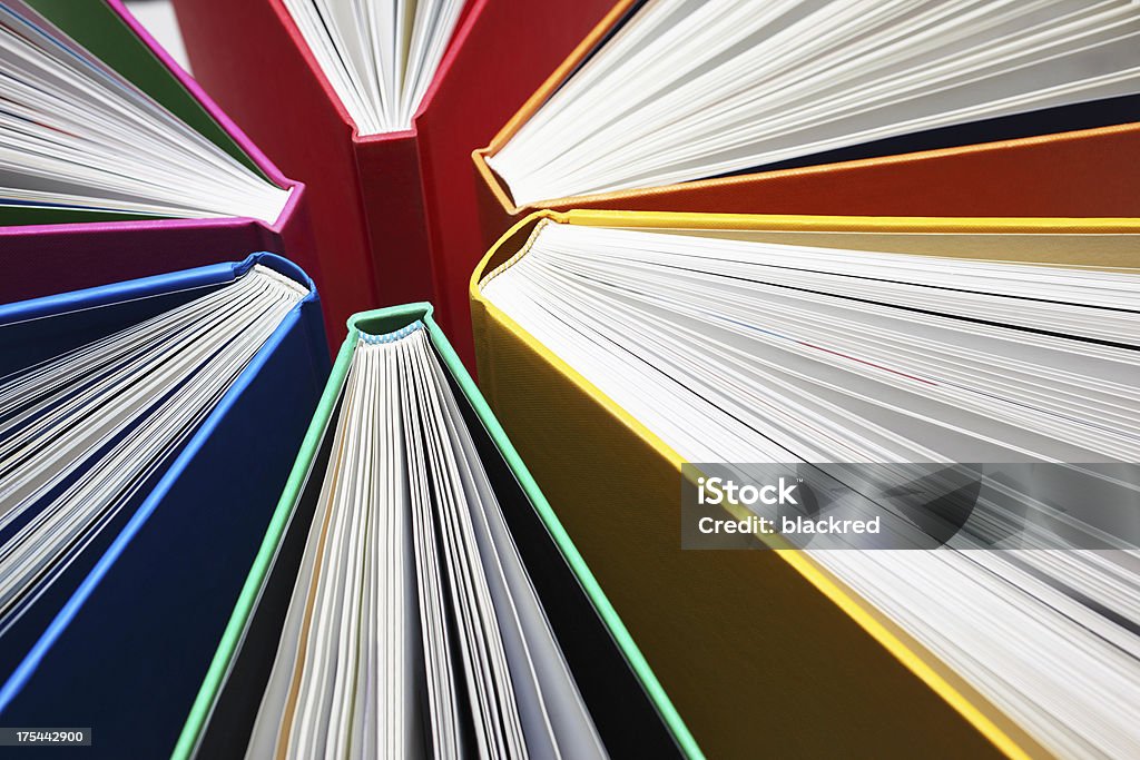 Colorful Books Abstract Fanned out colorful books forming light-beam like shape. Abstract Stock Photo