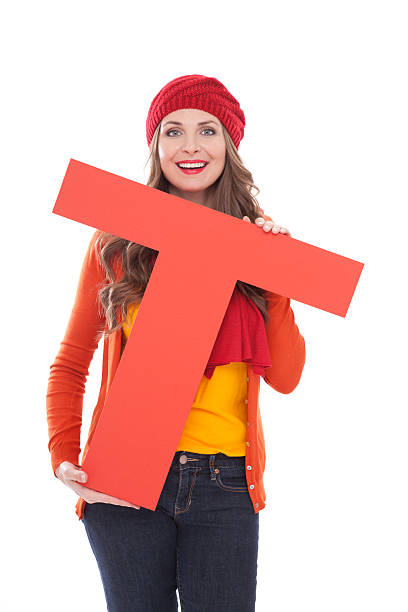 istock Woman holding letter T. 175443297