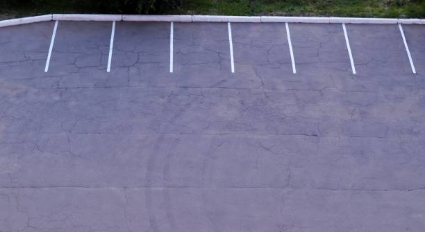 istock A designated empty parking lot for vehicles from a bird's eye view. 1754434002