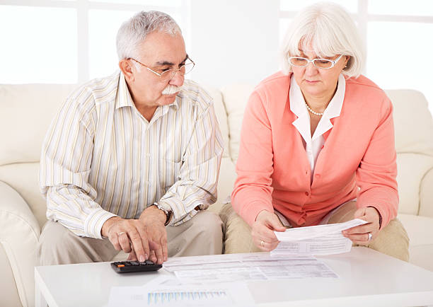 istock Senior couple with bills. 175443544