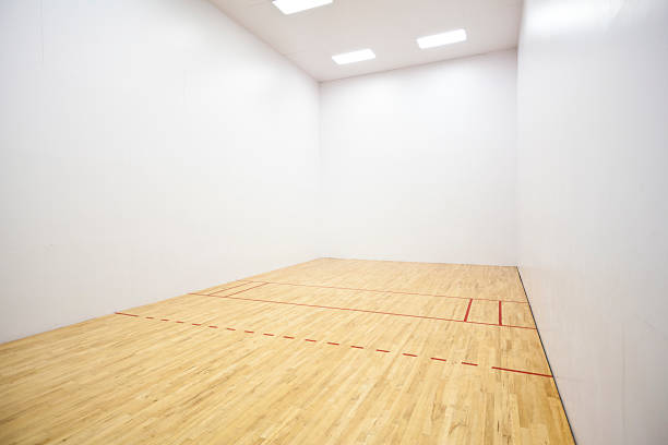 Racquetball Court Empty racquetball court with wood floor and lines. racketball stock pictures, royalty-free photos & images