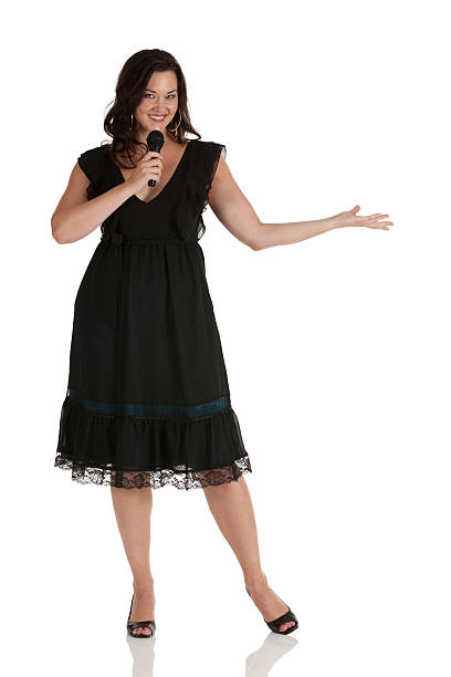 istock Happy woman singing into a microphone 175443974
