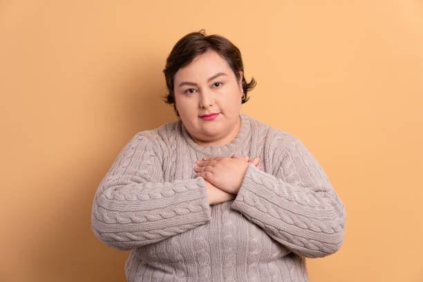 istock Kind woman with hands over heart, chest 1754440431