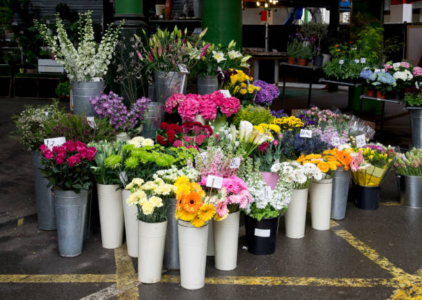 Flower stall A beautiful display of flowers for sale in a London market. flower market stock pictures, royalty-free photos & images