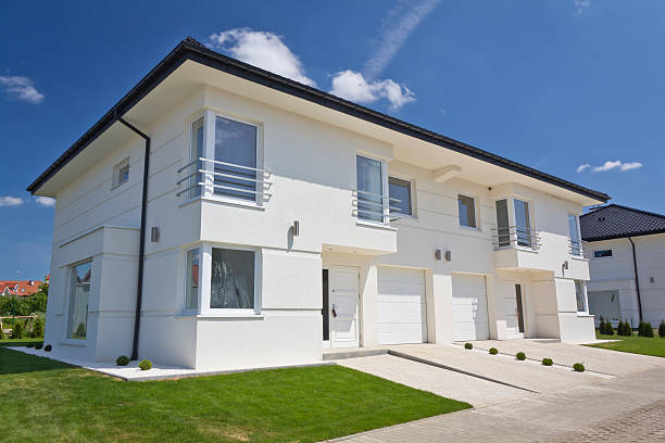 istock White apartment house against blue skies 175444509