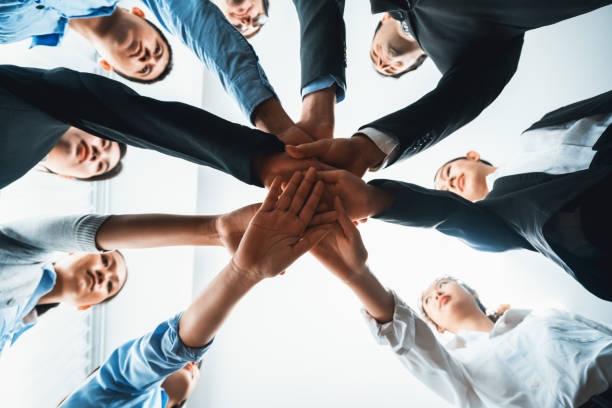 istock Multiracial business people make synergy hand stack together. Habiliment 1754448114