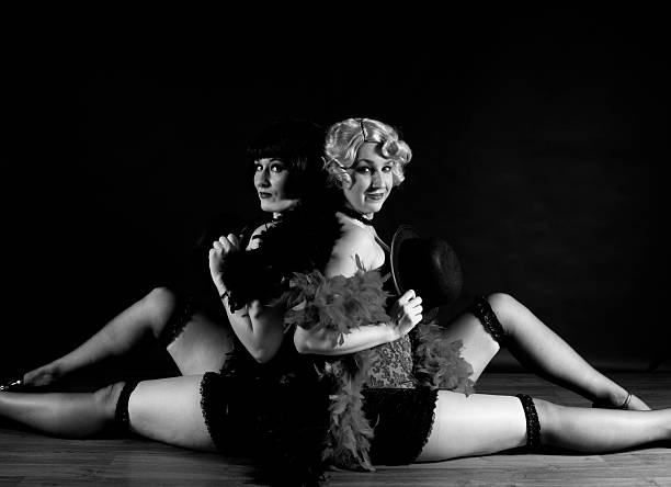 Two Female Actresses On Stage Two Beautiful Young Actresses On Stage in 1920s Costumes burlesque stock pictures, royalty-free photos & images