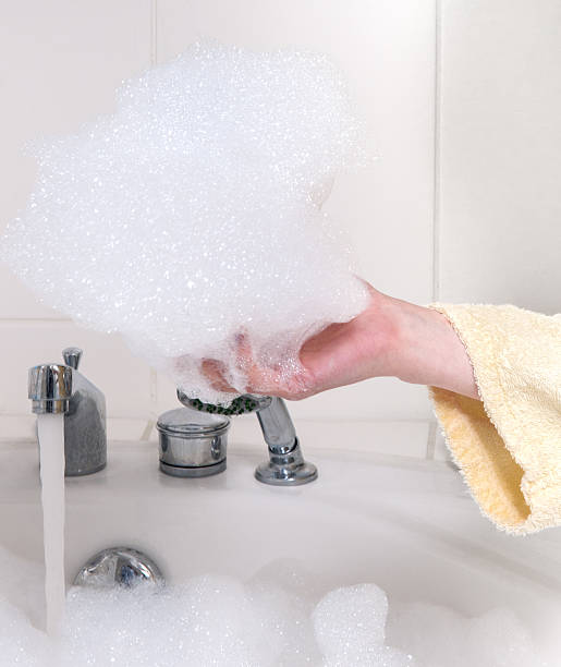 istock Woman hands in a bath with foam 175445387