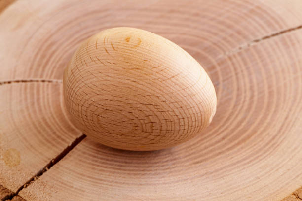 a wooden egg on the wooden floor