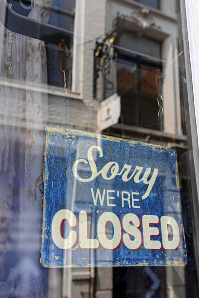 istock sorry closed - store sign. Reflection in window 175445704